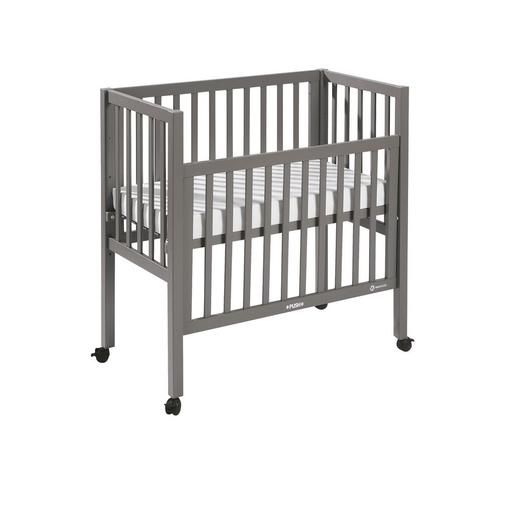 Space saver cot with cheap drop side